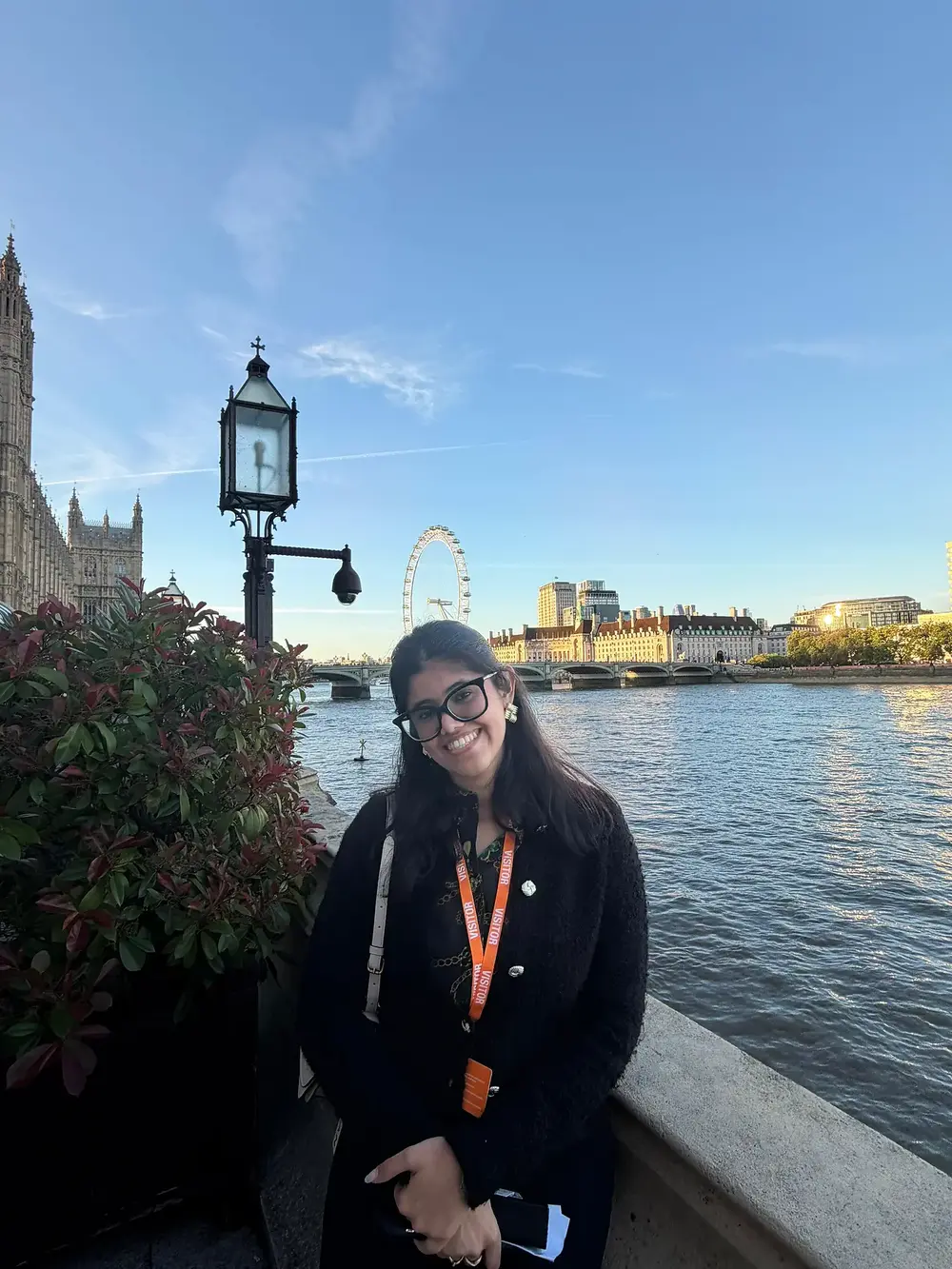 Anupriya Nagar in a black coat at the Houses of Parliament, London